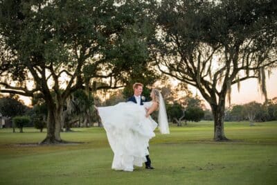 bride being dipped by her groom, outdoors, sunset, Rockledge Country Club, Orlando, FL