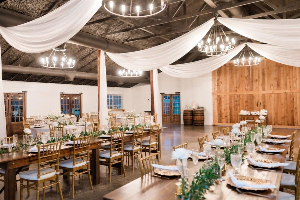 large venue for a wedding reception, long tables, wood wall, Moss Estates, Orlando, FL