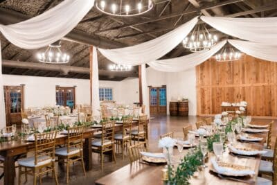 large venue for a wedding reception, long tables, wood wall, Moss Estates, Orlando, FL