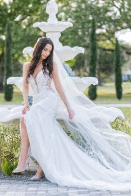 bride in her wedding dress, outdoors, long gown, sitting at the fountain, Rockledge Country Club, Orlando, FL