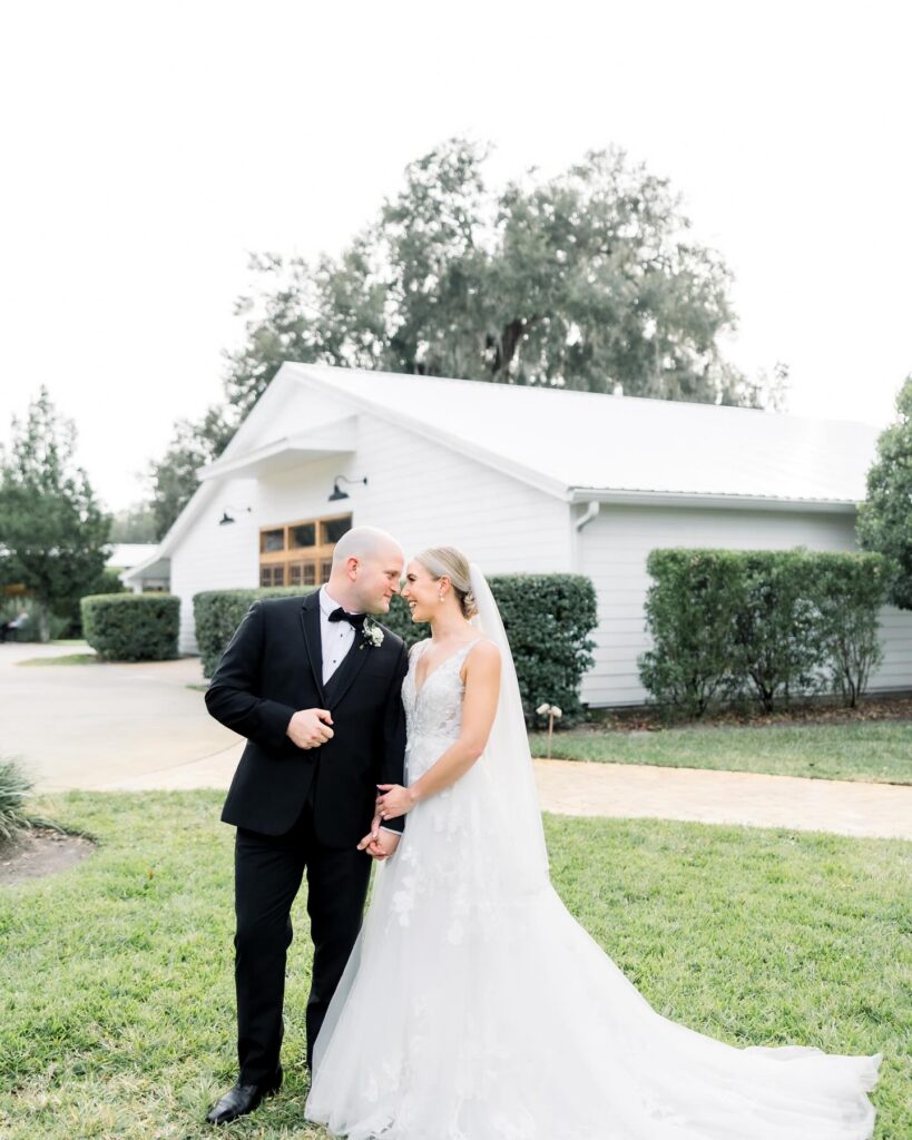 bride and groom in an intimate moment on their wedding day, outside the venue, Orlando, FL