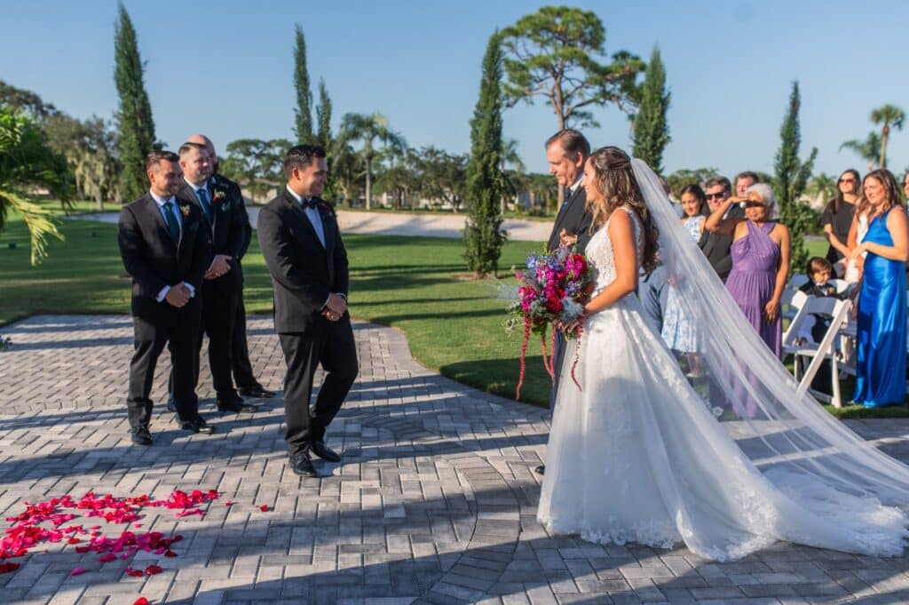 bride and her father walking down the aisle towards the groom and the altar, Rockeldge Country Club, Orlando, FL