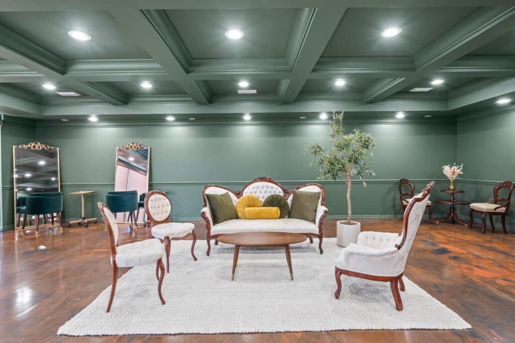 indoor lounge area, green walls, white area rug, hardwood floors, Orlando, FL
