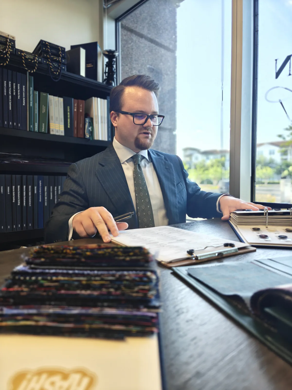 custom-suit-tailor-in-orlando-carl-axen-clothier-taking-notes-for-custom-suit-order