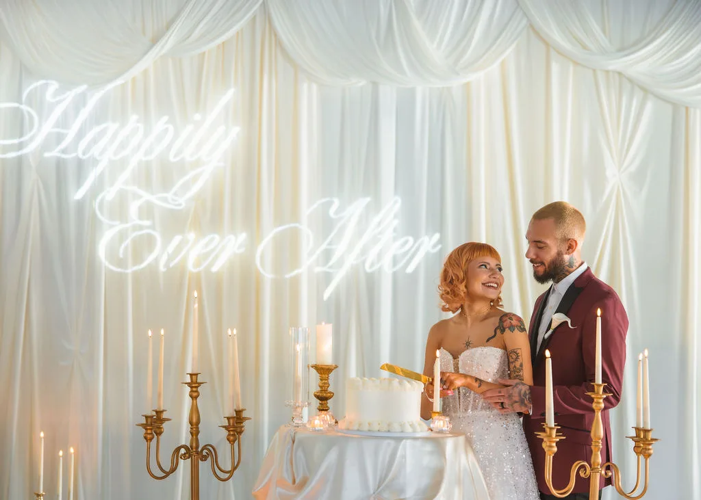 couple celebrating their cake cutting for their romantic wedding