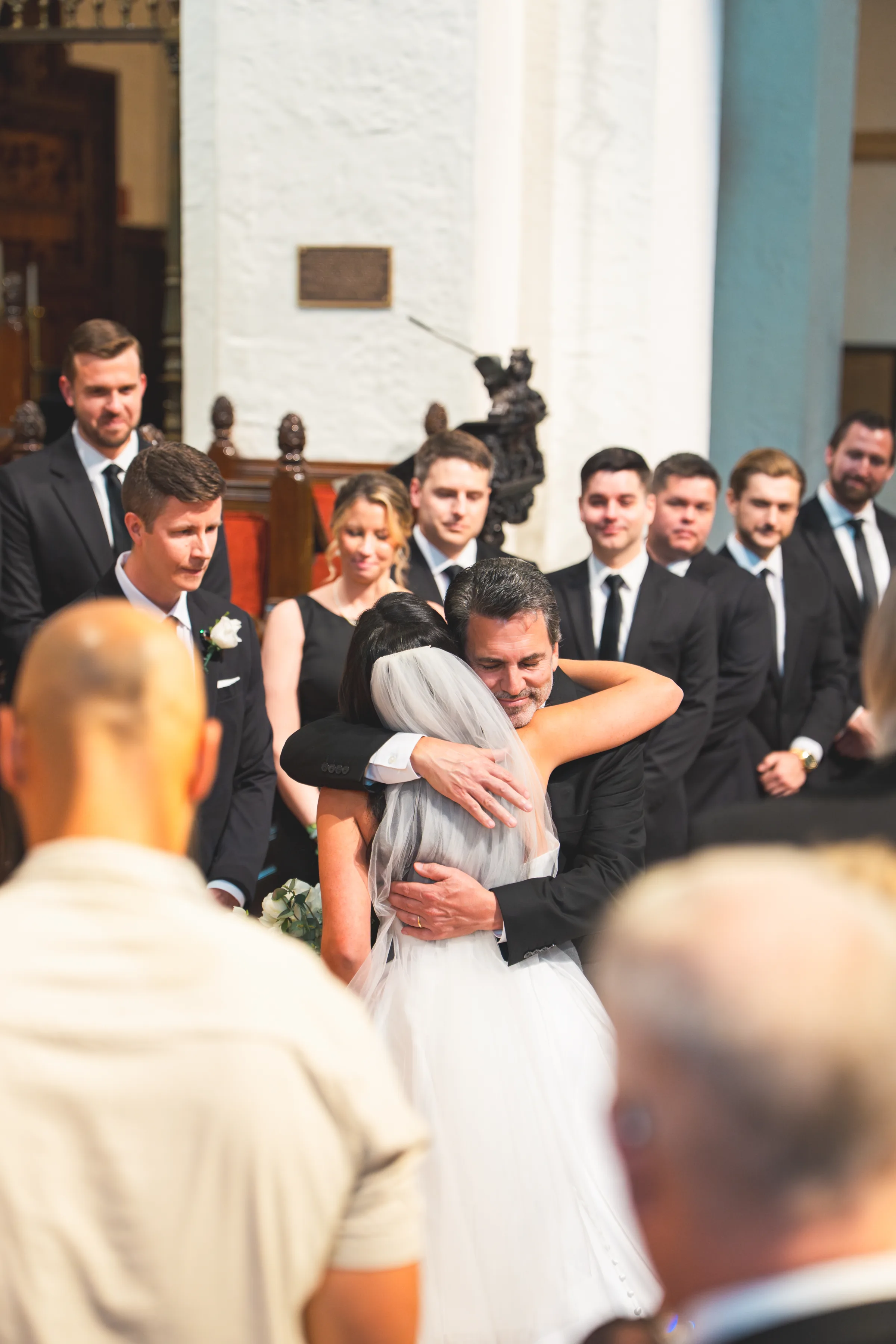 CodyKarinaWedding03 15 2026 529 - European Inspired Wedding | Rollins College Emotional hug between father and daughter at european inspired wedding at Rollins College