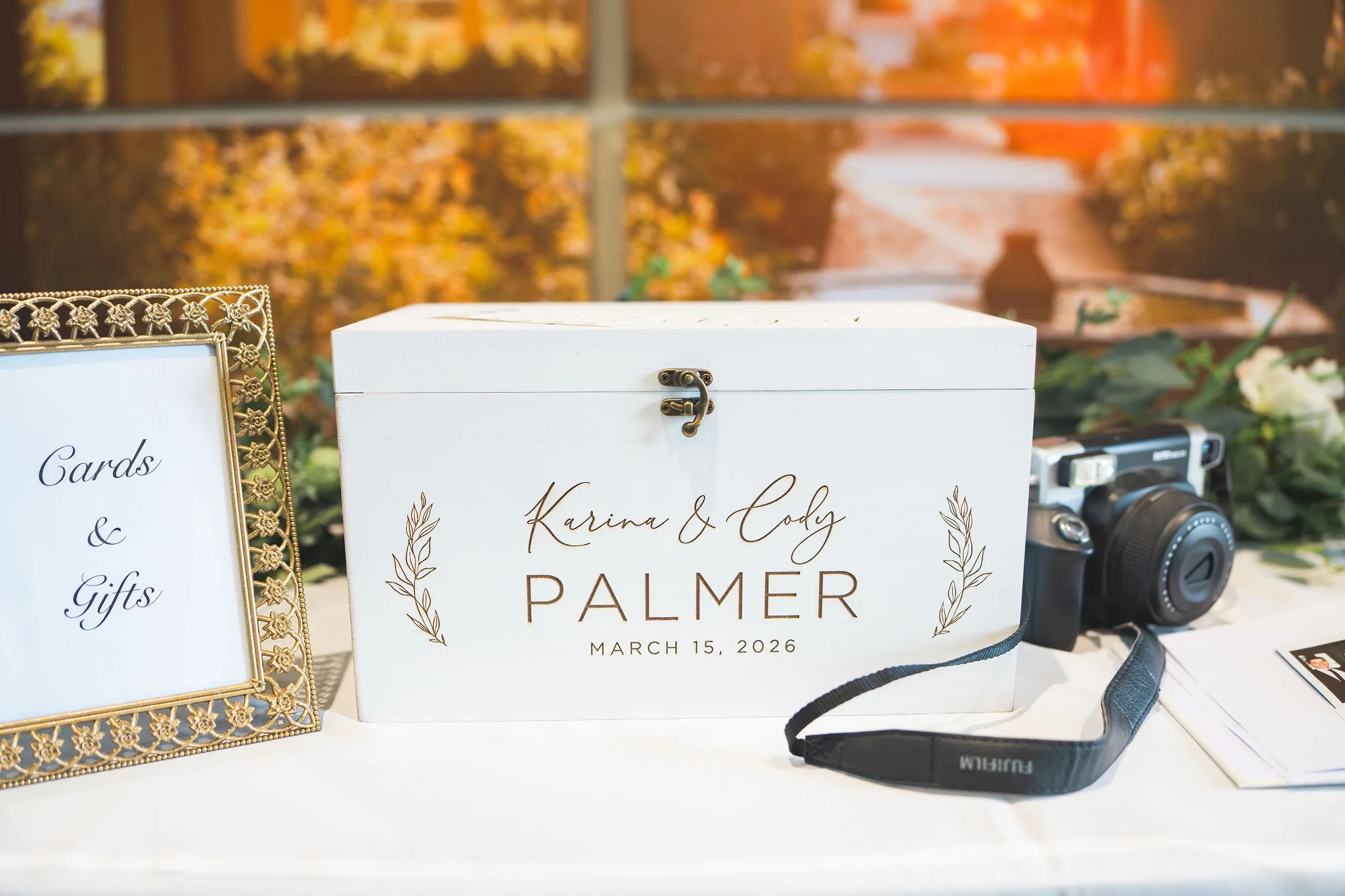 CodyKarinaWedding03.15.2026 39 - European Inspired Wedding | Rollins College Custom white Karina and Cody Palmer card box with March 15 2026 wedding date and film camera at reception