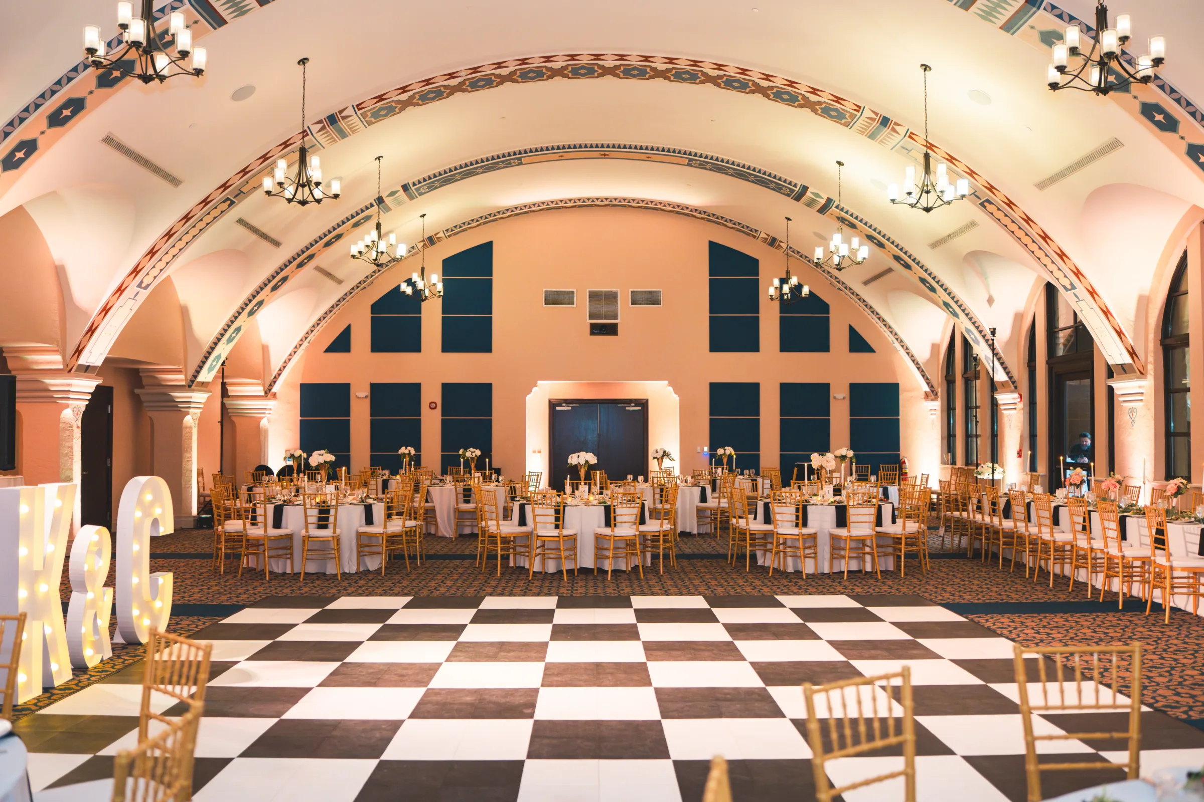 CodyKarinaWedding03.15.2026 844 1 - European Inspired Wedding | Rollins College Rice Family Pavilion reception hall with checkered dance floor and European arched ceiling at Rollins College