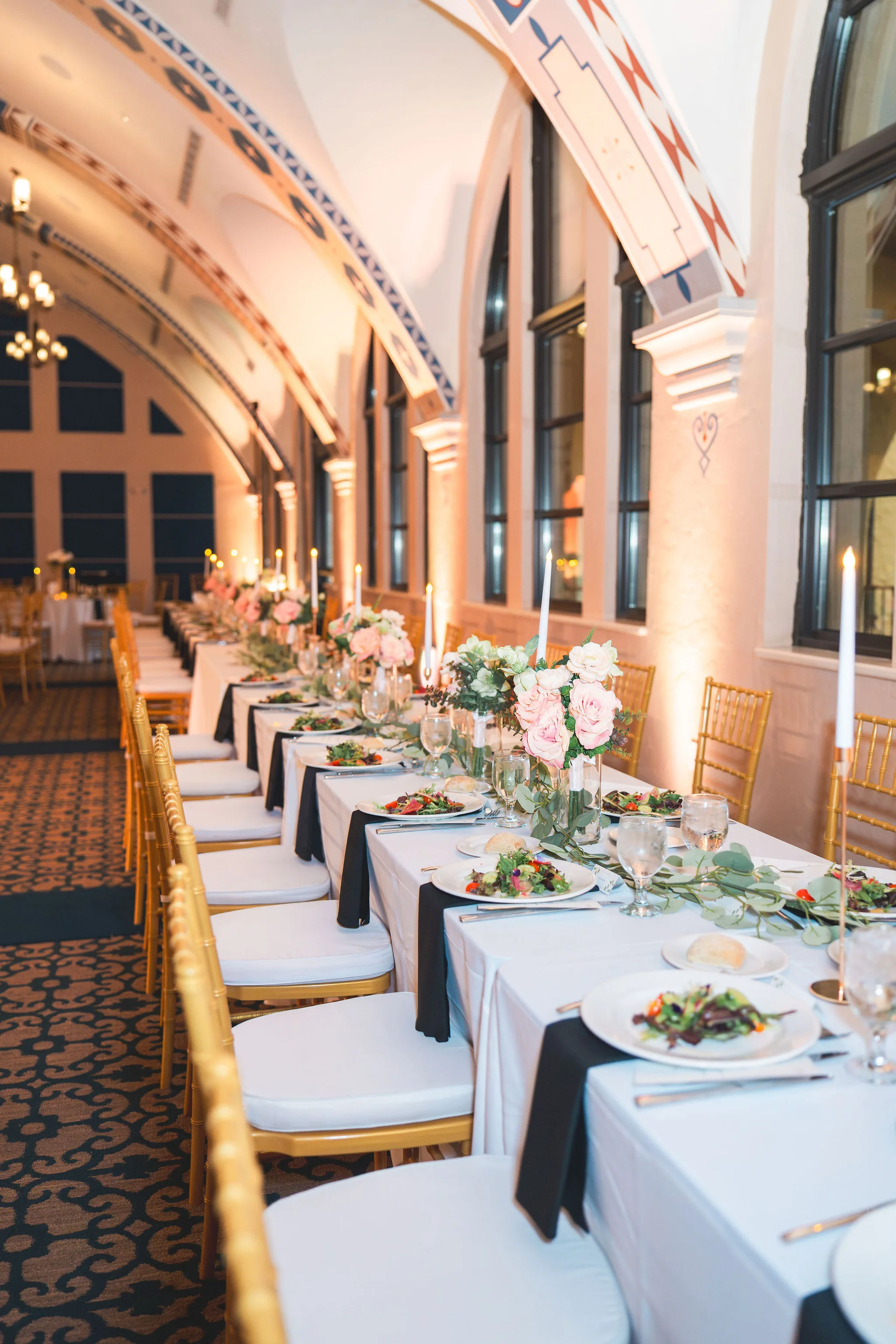 CodyKarinaWedding03.15.2026 845 - European Inspired Wedding | Rollins College Long reception table with gold chivari chairs and arched ceiling at Rollins College european inspired wedding