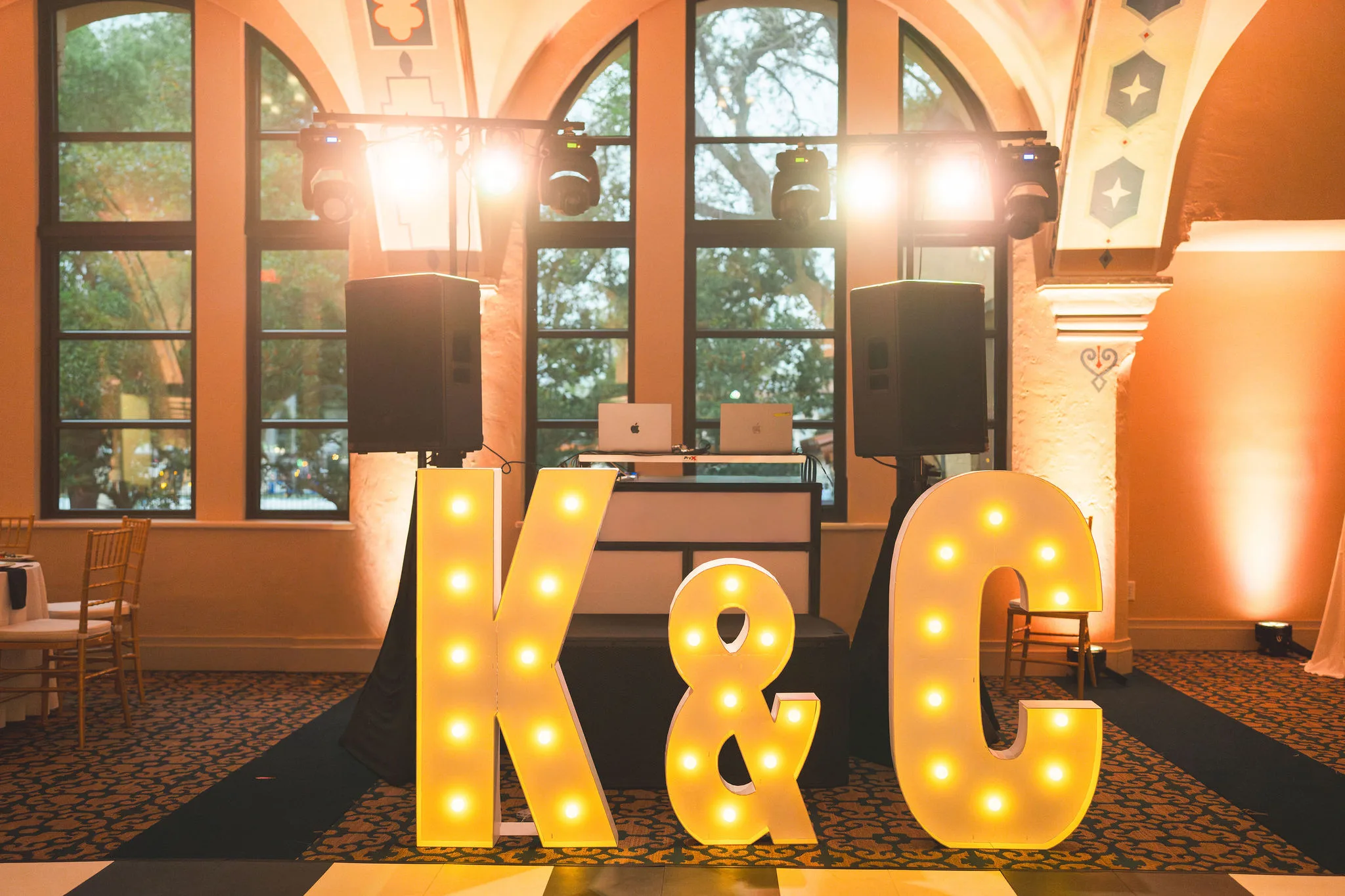 CodyKarinaWedding03.15.2026 849 - European Inspired Wedding | Rollins College Illuminated K and ampersand marquee letters near DJ booth at Rollins College european inspired wedding reception