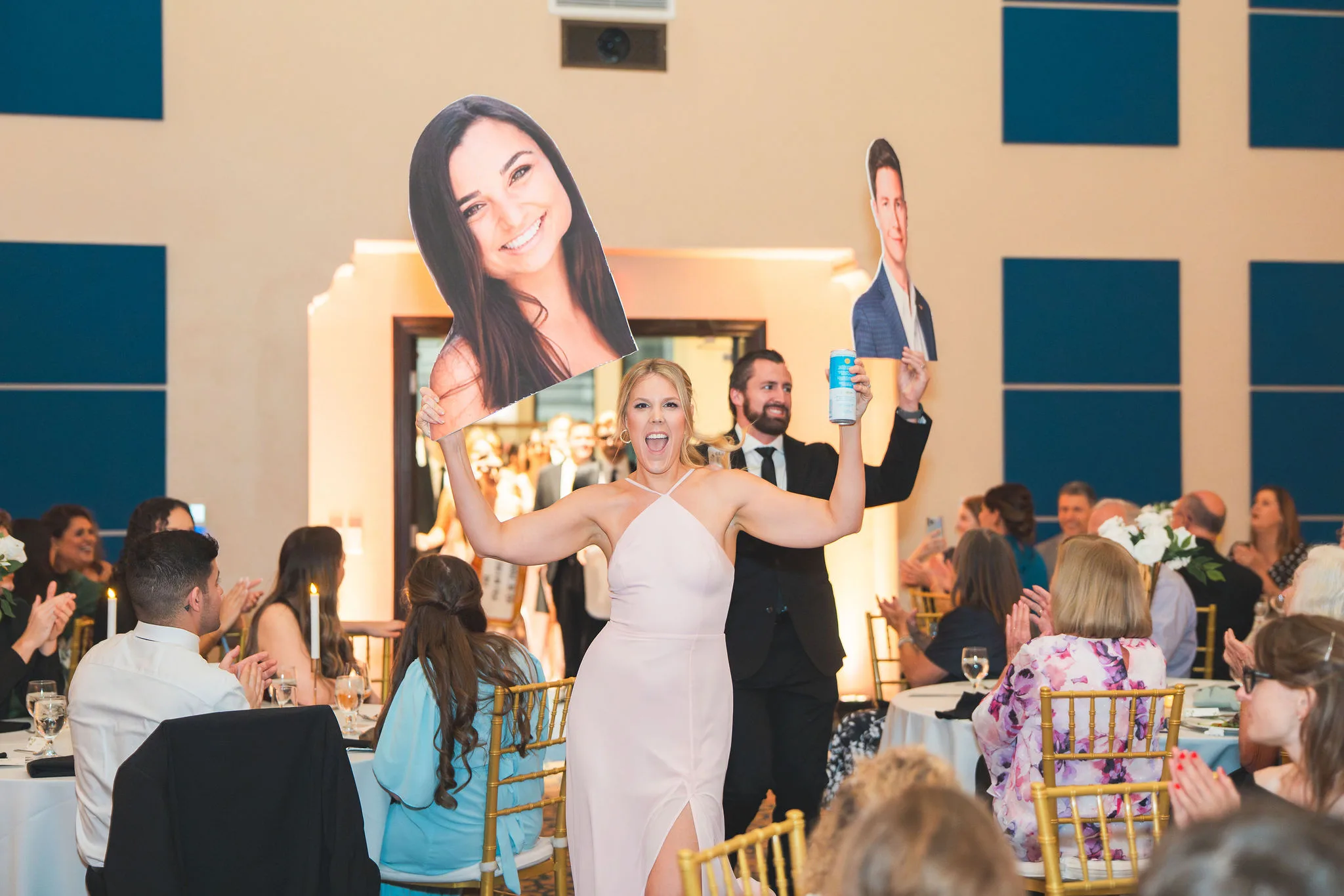 CodyKarinaWedding03.15.2026 930 - European Inspired Wedding | Rollins College Bridal party walking out with large head cut outs of the bride and groom.