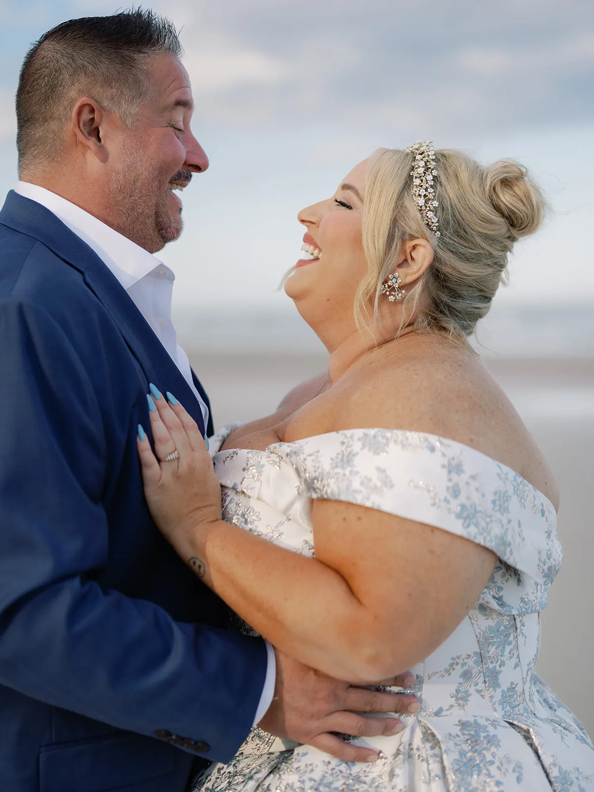 BB Post 120 - Romantic Blush and Blue Daytona Beach Wedding Bride and groom smiling at each other