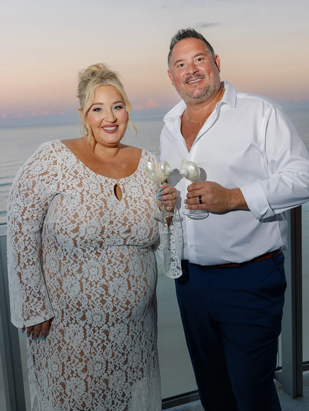 BB Rec 061 - Romantic Blush and Blue Daytona Beach Wedding Bride and groom cheers at reception