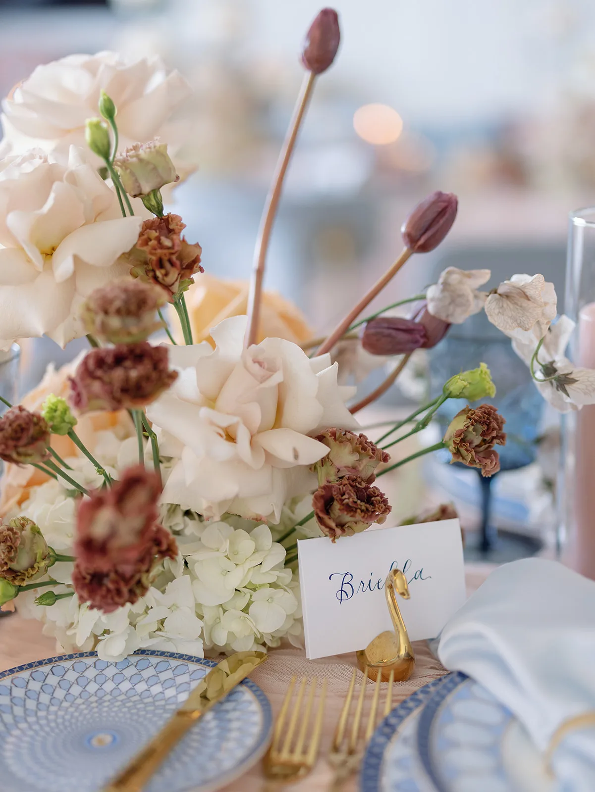 BB Rec Details 108 - Romantic Blush and Blue Daytona Beach Wedding Florals on table with swan name card holder