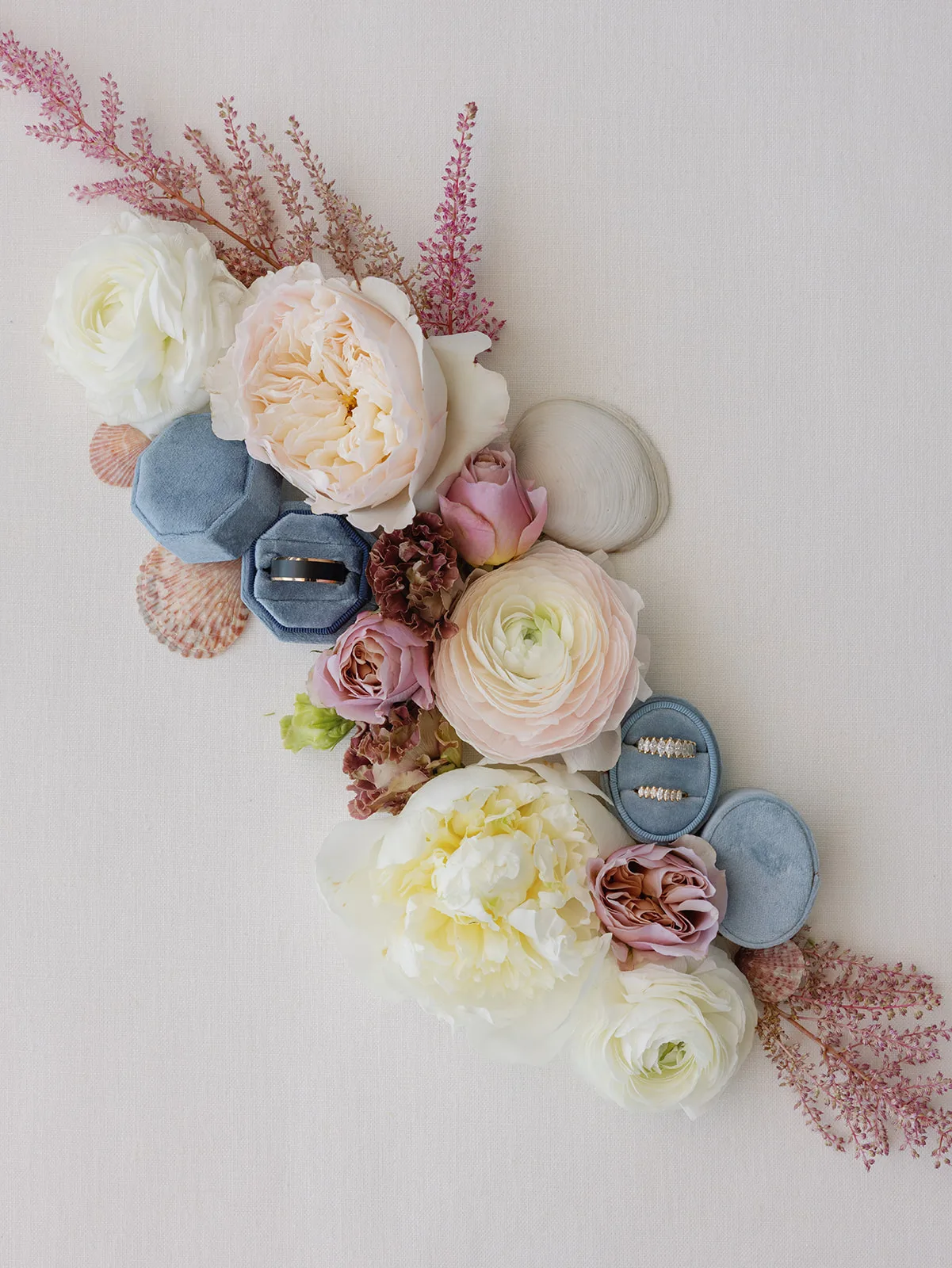 BB preview 001 - Romantic Blush and Blue Daytona Beach Wedding Wedding rings detail shot with blush flowers