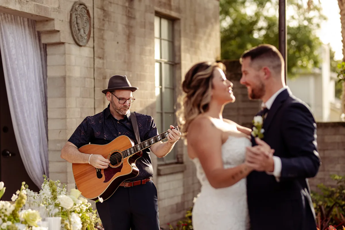 Custom wedding song 2 - Custom Wedding Songs: The Most Personal Part of Your Wedding That Lasts Forever Live wedding musician playing guitar while a newlywed couple shares a dance