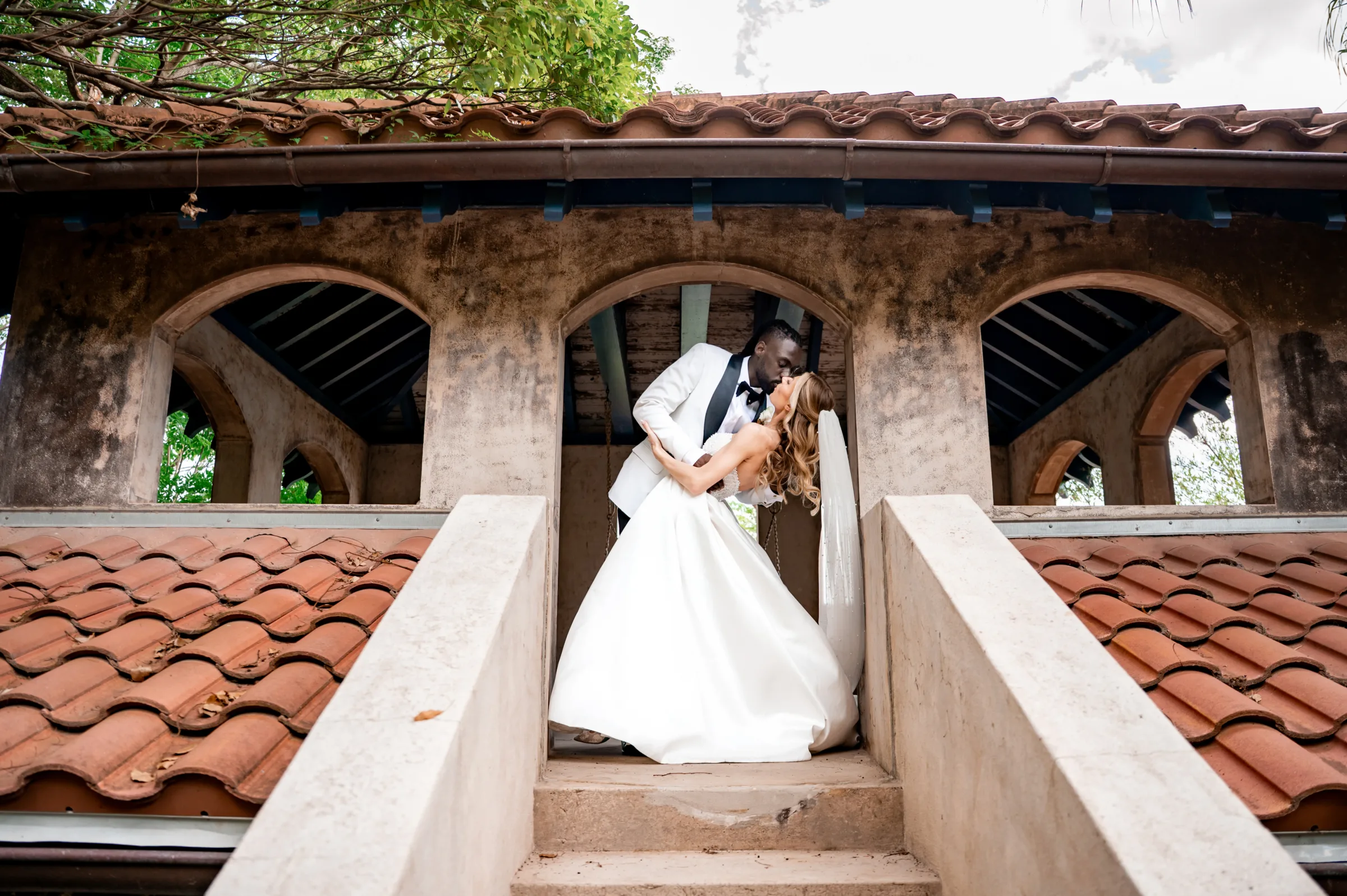 Elegant Sydonie Mansion Wedding 59 - An Elegant Sydonie Mansion Wedding With a Playful Twist Bride and groom kissing at elegant sydonie mansion wedding