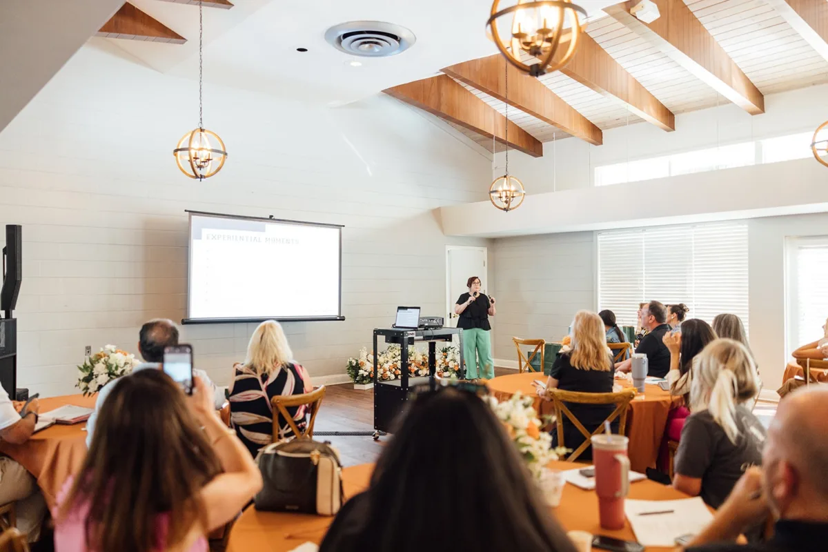 Shannon Tarrant on Stage Speaking to Venue Owners - Your Local Central Florida Wedding Venue & Vendor Guide Shannon Tarrant on Stage Speaking to Venue Owners
