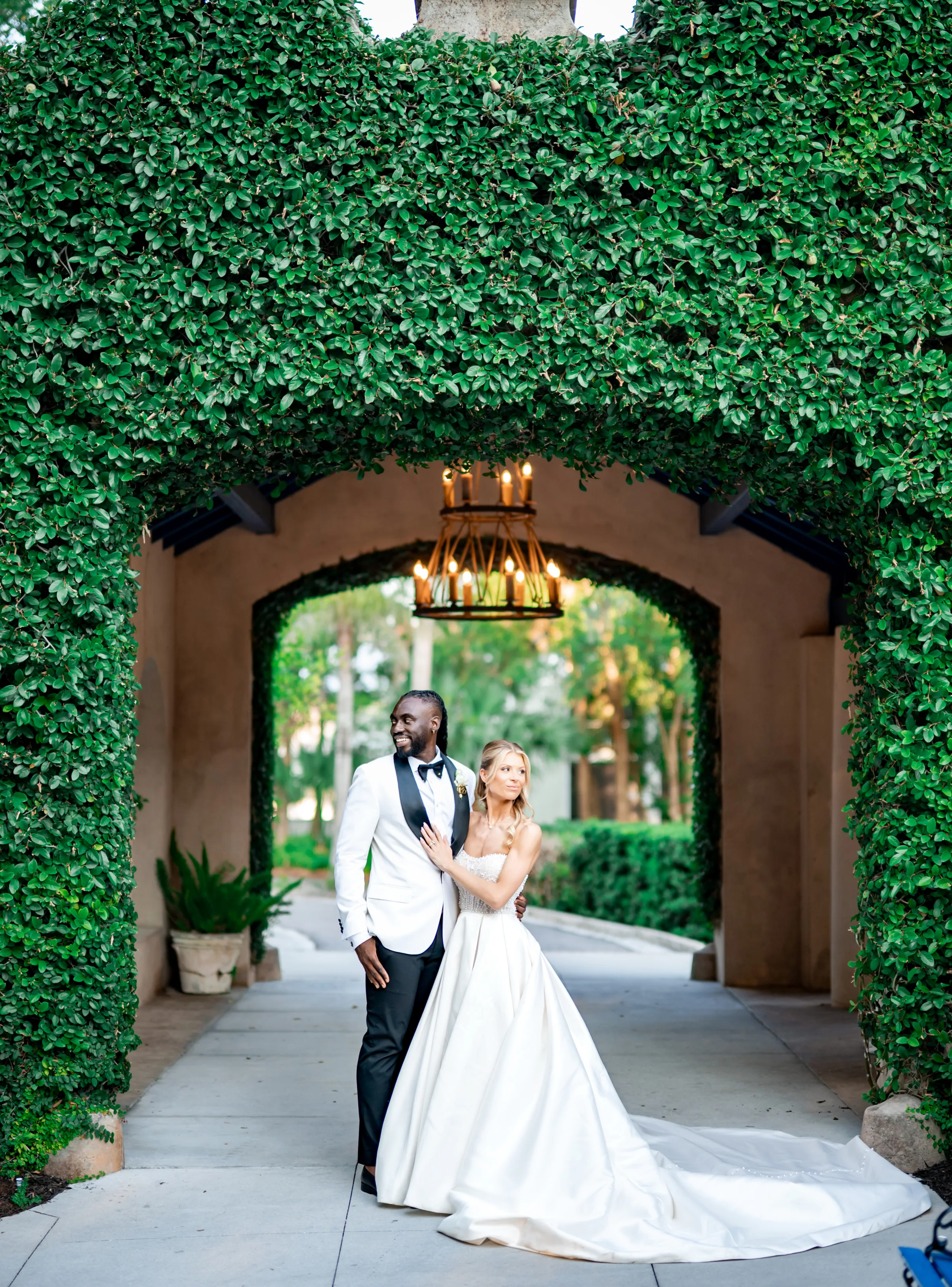 sydonie mansion bella grey photography florida wedding - How Do You Know You've Found the Right Wedding Venue? Couple standing under bridge, just married
