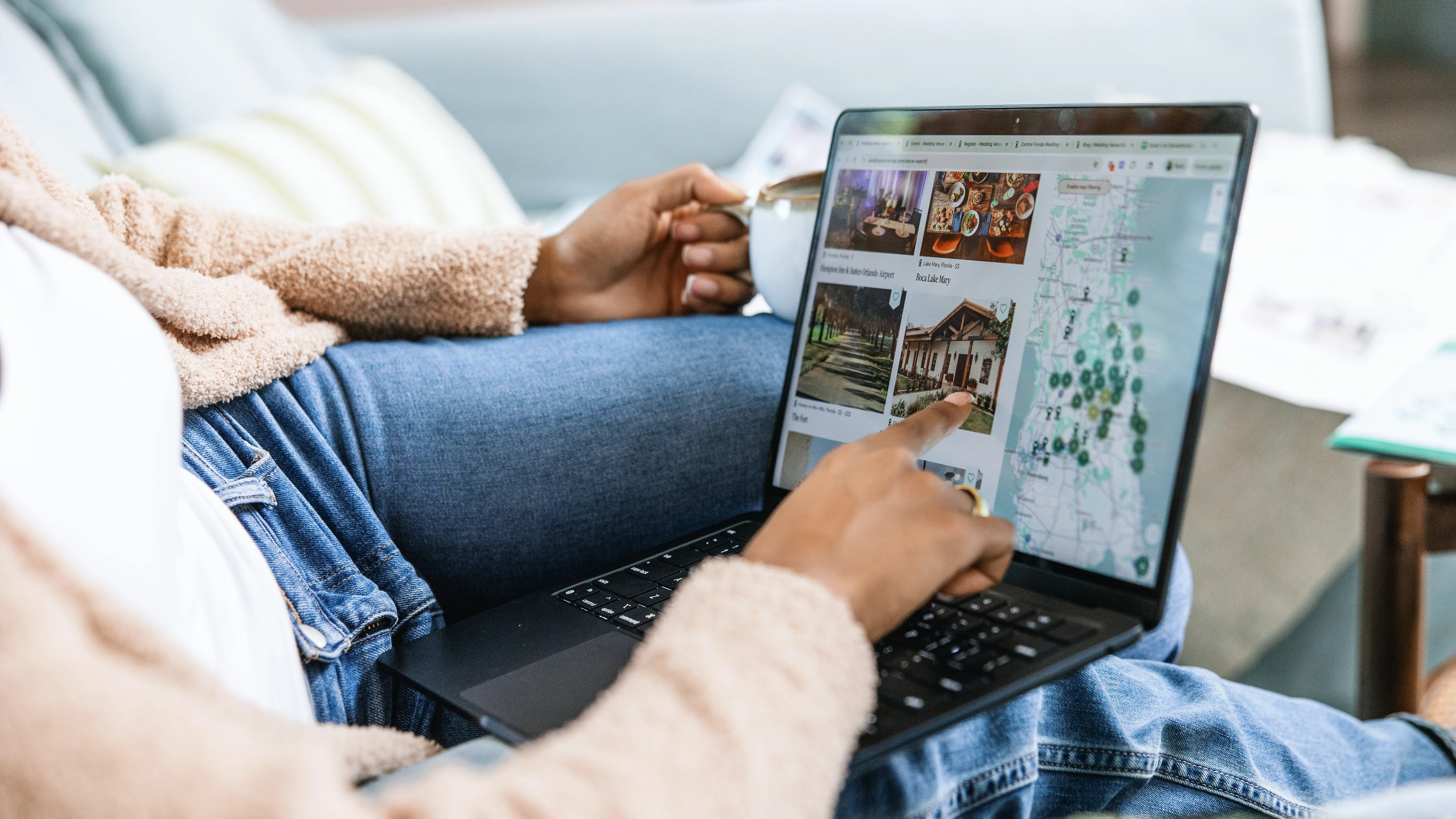 just engaged wedding venue planning research laptop edited - Just Engaged? Now What? Newly engaged woman browses wedding venues and maps on a laptop while relaxing on a couch, researching wedding planning options in Orlando and Central Florida