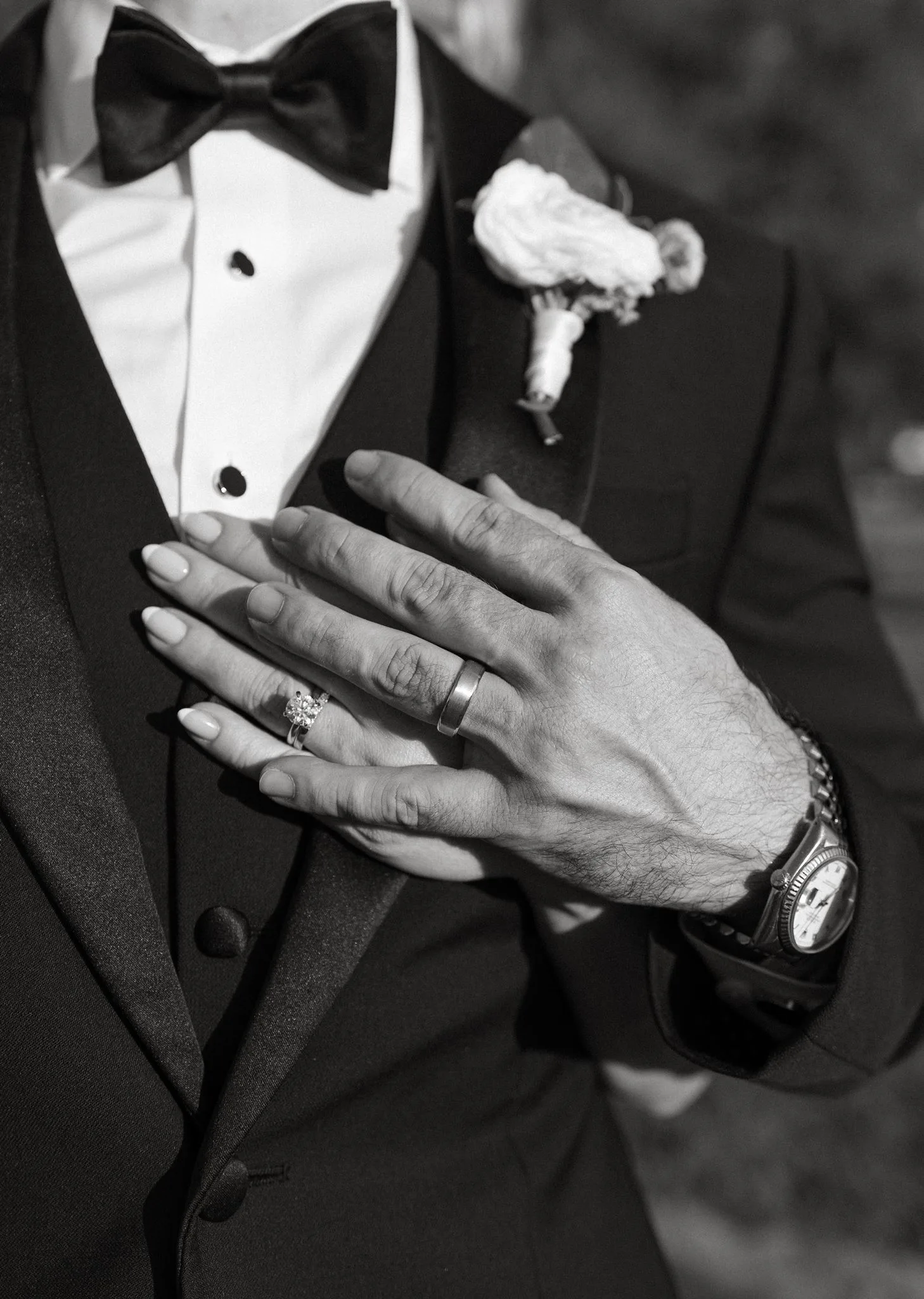 lilac ivory wedding rings tuxedo la hacienda snow hill - An Elegant Lilac and Ivory Wedding at La Hacienda on Snow Hill Bride and groom wedding rings displayed against groom's tuxedo lapel with boutonniere at La Hacienda on Snow Hill in Orlando, Florida, lilac and ivory wedding details