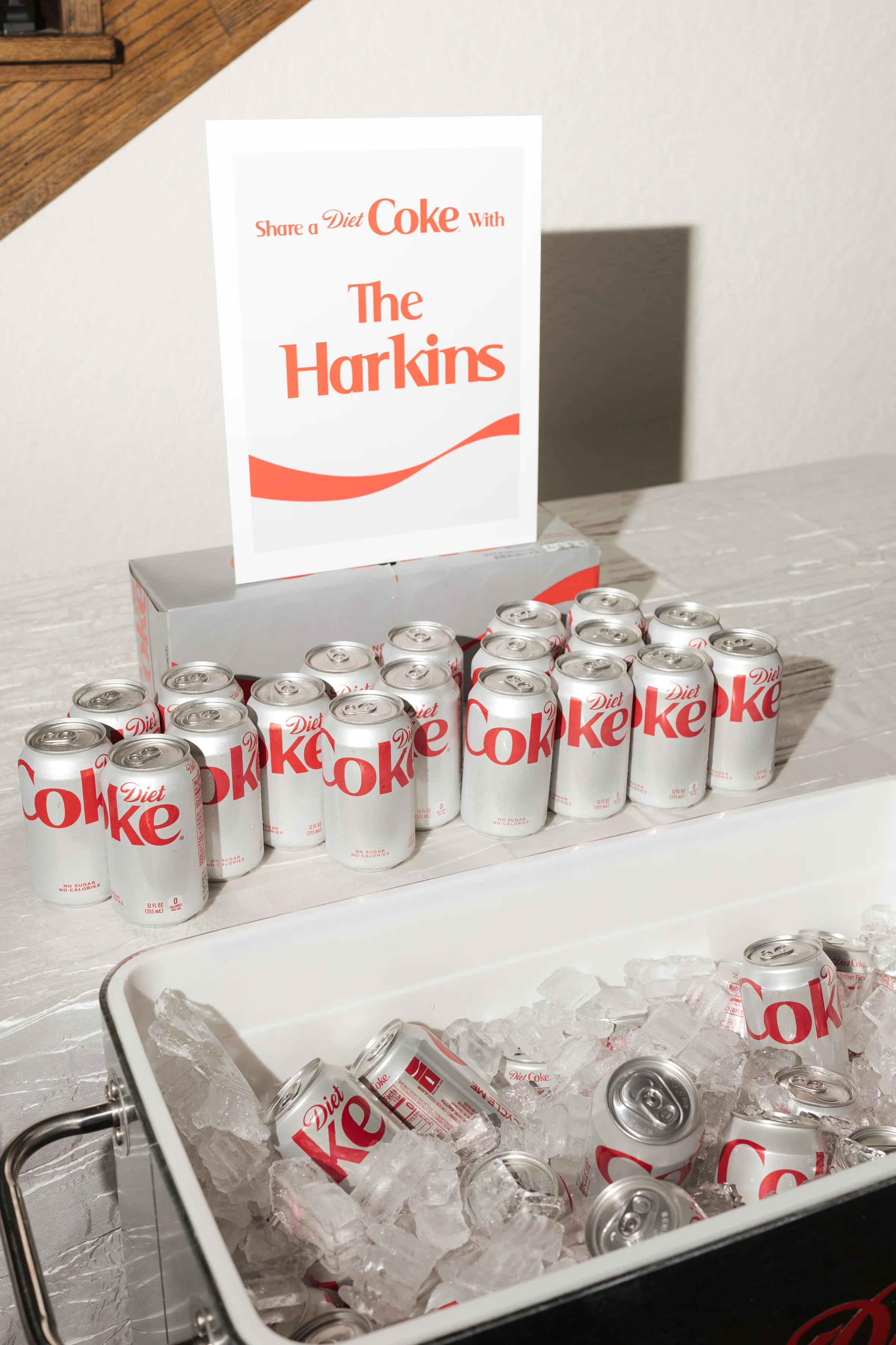 Personalized Share a Diet Coke with The Harkins sign displayed above chilled Diet Coke cans on ice at a wedding reception beverage station in Central Florida