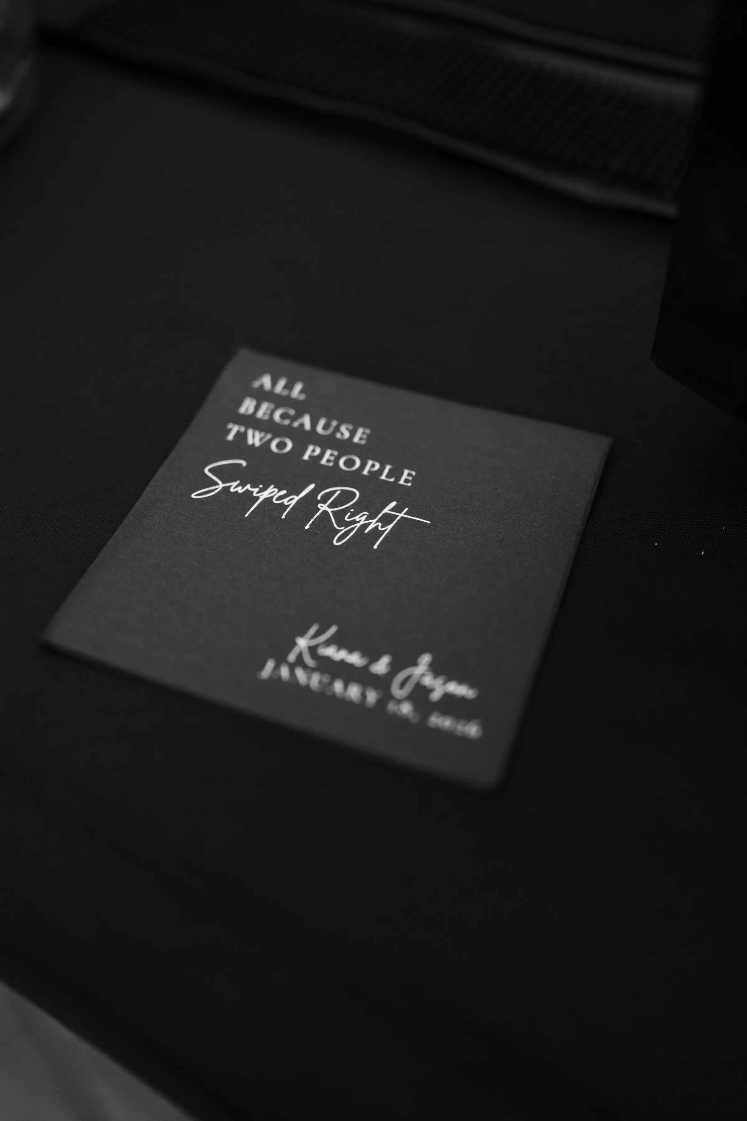 Black wedding label reading All Because Two People Swiped Right with couple names Kiara and Jason and January wedding date in Orlando Florida